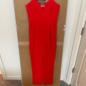 Bright red strapless jumpsuit by Amanda Uprichard